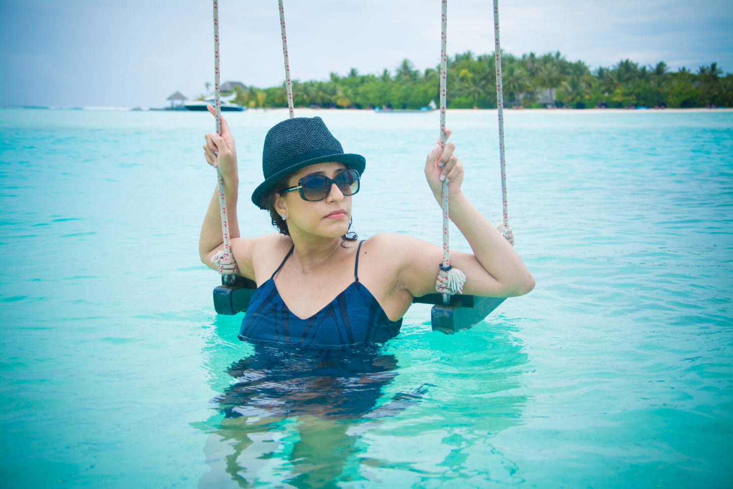 Swing your sorrows away in the clear Maldivian waters
